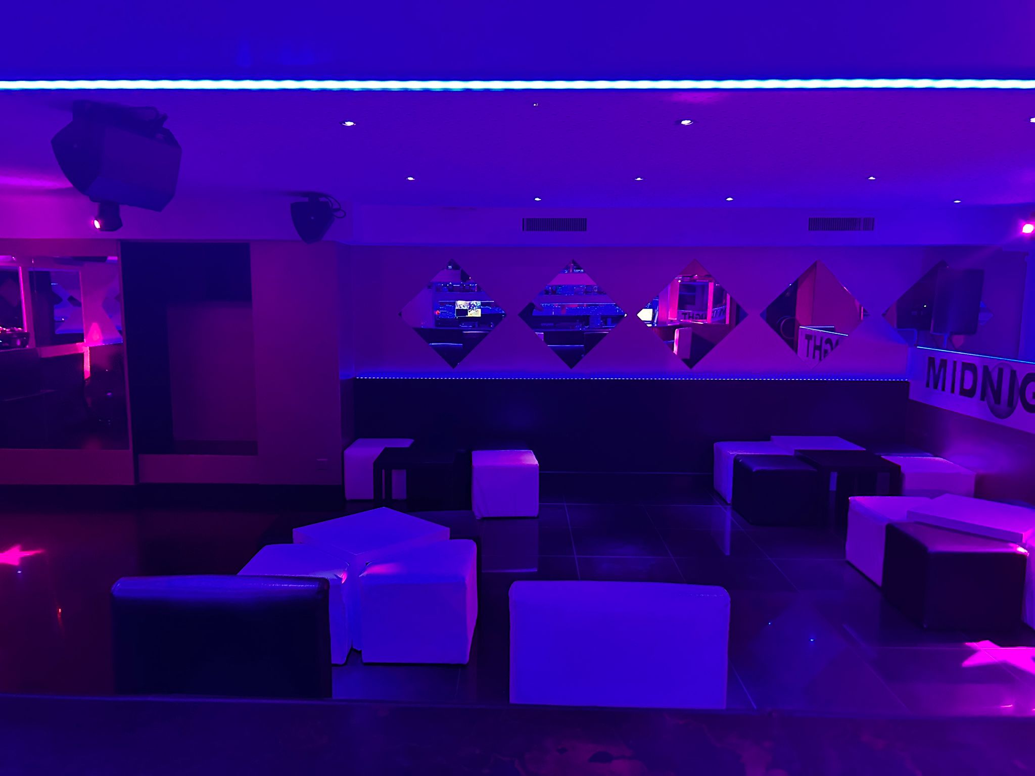 DJ performance with vibrant blue lighting